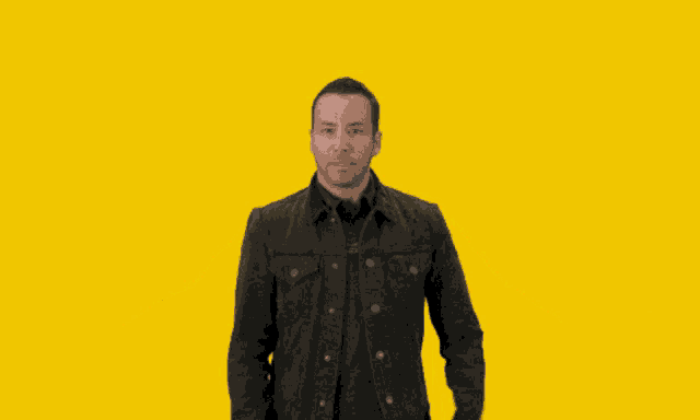 a man with his arms outstretched in front of a yellow background with the words tell me why