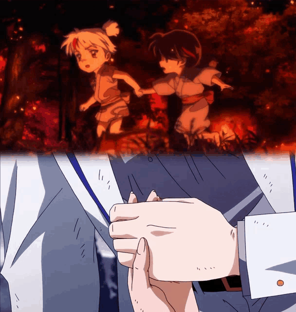 a person holding another person 's hand in front of a little girl