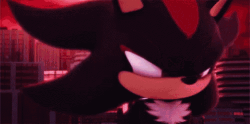 shadow the hedgehog from sonic the hedgehog is standing in front of a city skyline .