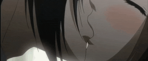 a close up of a person kissing another person 's cheek