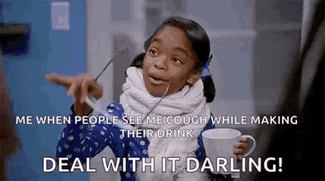 a little girl is holding a cup of coffee and talking on a cell phone while making their drink .