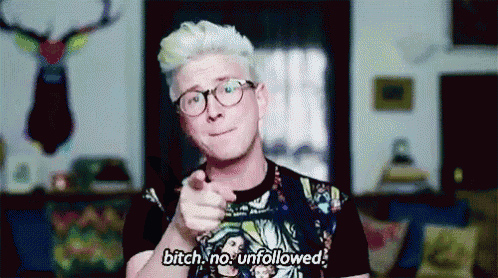 a man with white hair and glasses is pointing at the camera and saying bitch no unfollowed