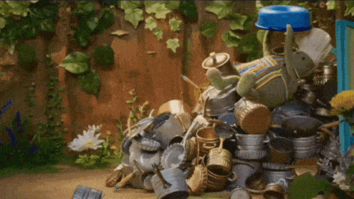 a stuffed elephant is sitting on top of a pile of trash