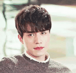 a close up of a man wearing a sweater and red lipstick .