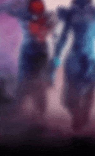 a blurry picture of a person 's face with a purple background