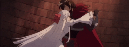 a man and a woman are looking at each other