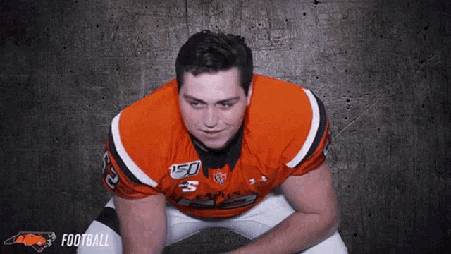 a man in a football uniform with the number 5 on his chest