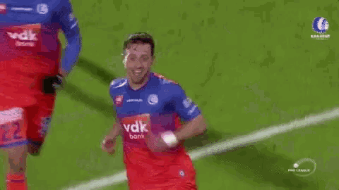 a group of soccer players are running on a field with the word pro league on the bottom