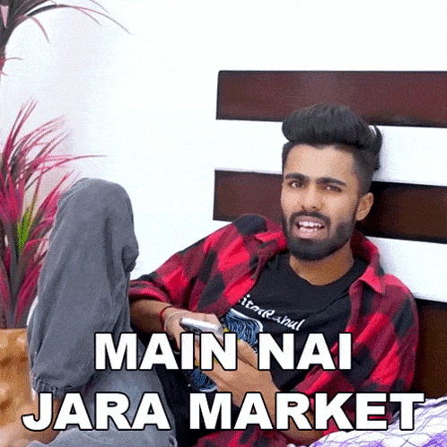 a man in a plaid shirt is laying on a bed with his legs crossed and the words main nai jara market above him