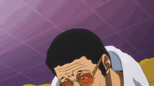 a man wearing sunglasses and a white shirt looks down at something