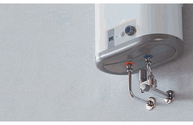 a water heater is mounted to a wall and has a digital display