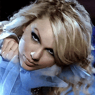 a close up of a woman 's face with blonde hair
