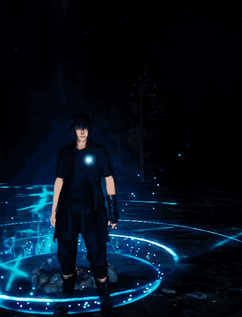 a man in a black shirt is standing in a circle of blue lights