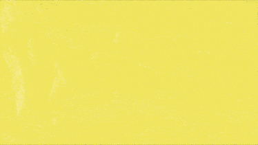a pair of black roller skates with yellow laces on a yellow background