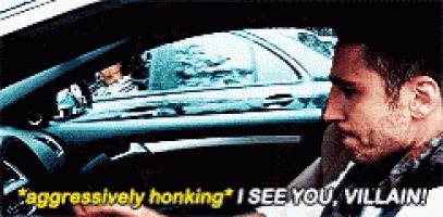 a man is driving a car and says " aggressively honking " i see you villain