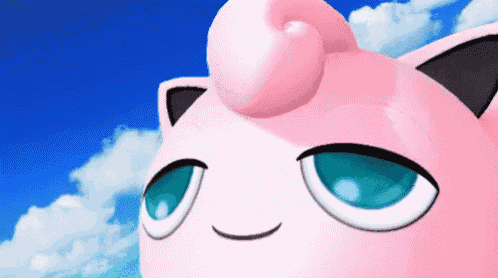 a close up of jigglypuff 's face against a blue sky with clouds