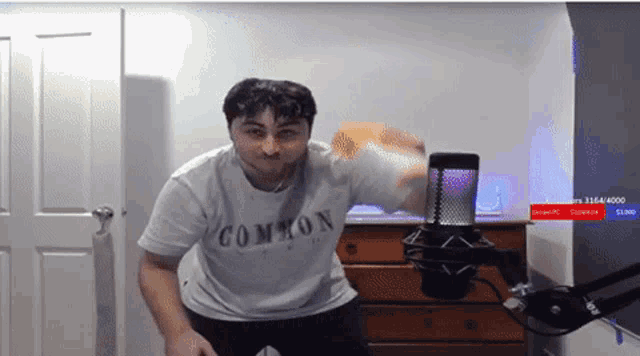 a man wearing a white shirt that says common