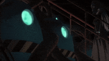 a person is standing in a dark room with a green light behind them