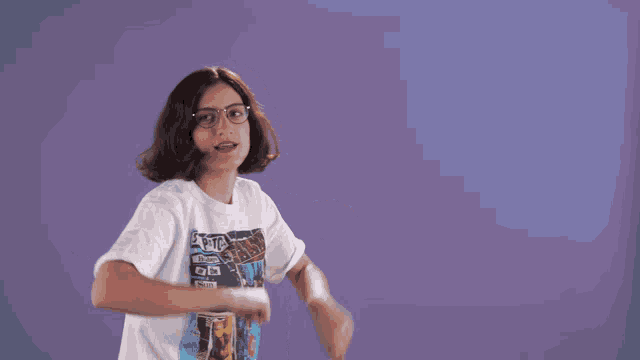 a girl wearing a white t-shirt with a picture of a man holding a sign that says " i love you "