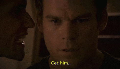 a close up of a man 's face with the words " get him " visible