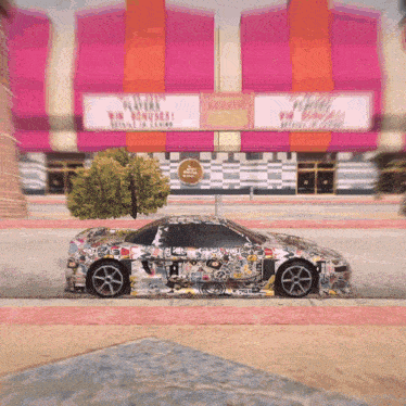 a car is parked in front of a building that has a sign that says aquatty