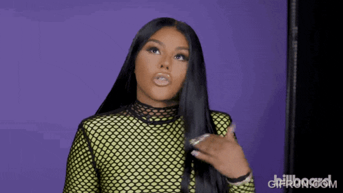 a woman with long black hair is standing in front of a purple background with billboard written on it