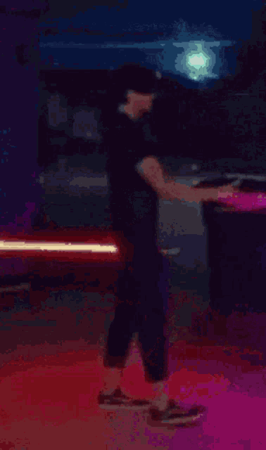 a person is holding a red light saber in their right hand