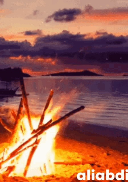 a painting of a fire on a beach with the name aliabdi