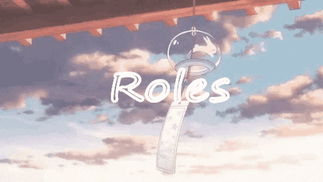 a wind chime hanging from a roof with the word roles written above it