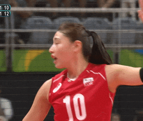 a female volleyball player with the number 10 on her jersey