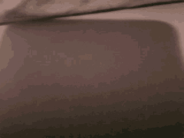 a gray surface with a shadow on it