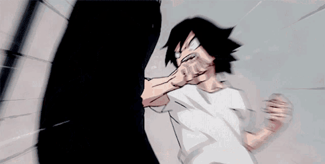 a man is punching a punching bag hanging from the ceiling .