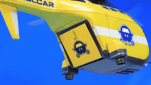 a yellow helicopter with volcar written on the side