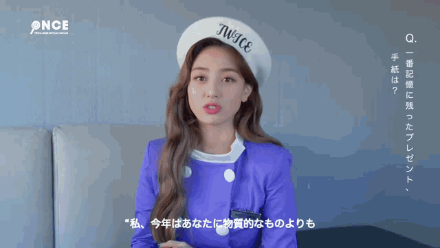 a woman wearing a beret that says twice