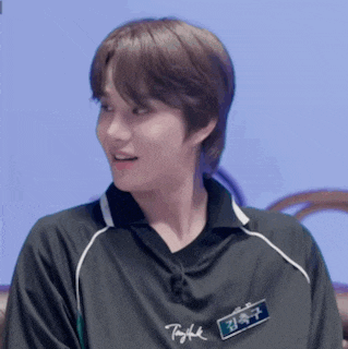 a young man wearing a black shirt with a name tag that says ' taylor '