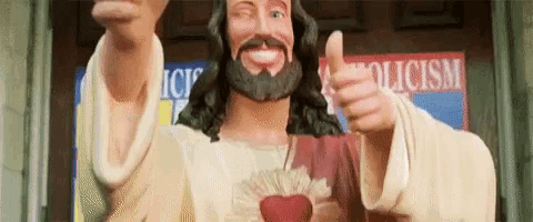 a statue of jesus is giving a thumbs up in front of a sign that says police .