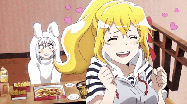 a girl is sitting at a table with a box of pizza and a bottle that says ring