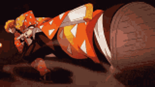 a cartoon character is laying on the ground with a sword in his hand