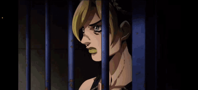 a cartoon character behind bars with a yellow tongue