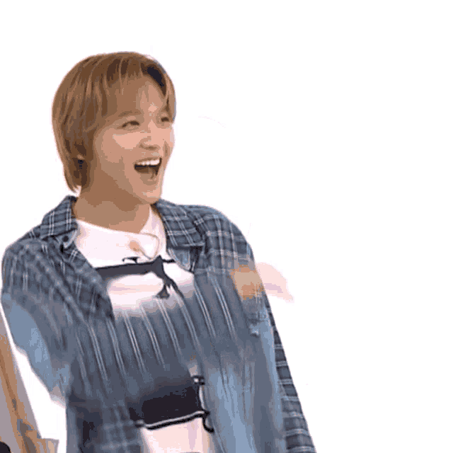 a young man wearing a plaid shirt and a denim jacket is waving