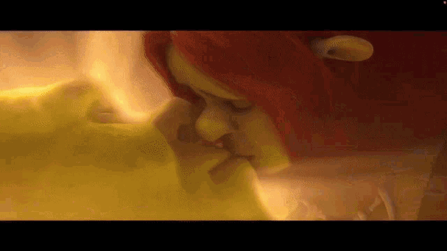 a man and a woman are kissing each other in a yellow room .