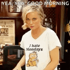 a woman wearing a t-shirt that says `` i hate mondays ''