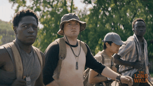 a movie poster for the long walk shows a group of young men standing next to each other