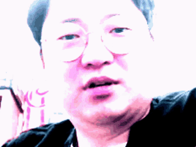 a close up of a person 's face with a pink lip and a black jacket