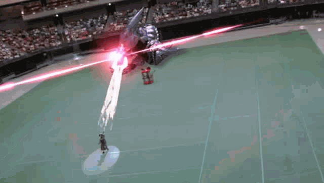 a person is standing in the middle of a stadium with a red light coming from the stands