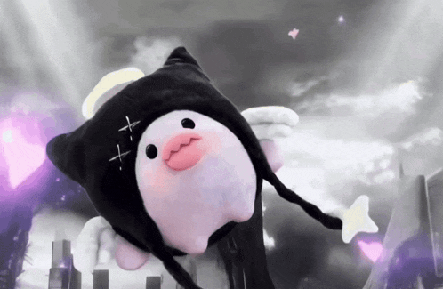 a stuffed animal with wings and a cross on its head
