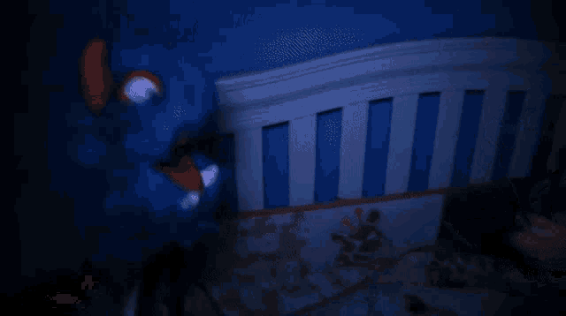 a person is holding a flashlight in front of a baby crib