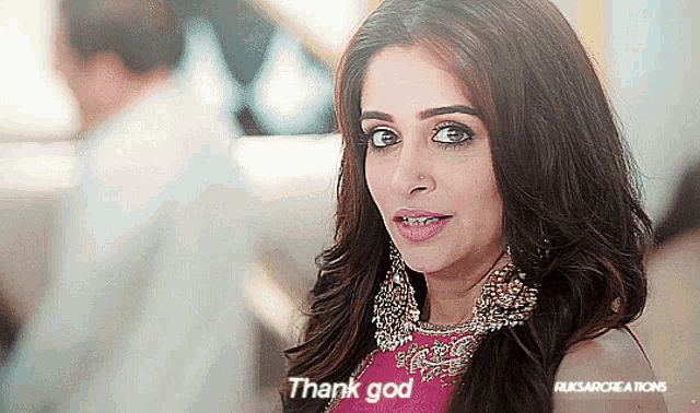 a woman says " thank god " in a pink dress