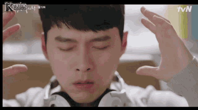 a close up of a person 's face with the tvn logo in the corner
