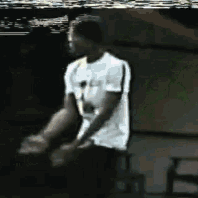 a blurry picture of a man in a white shirt with the number 7 on it
